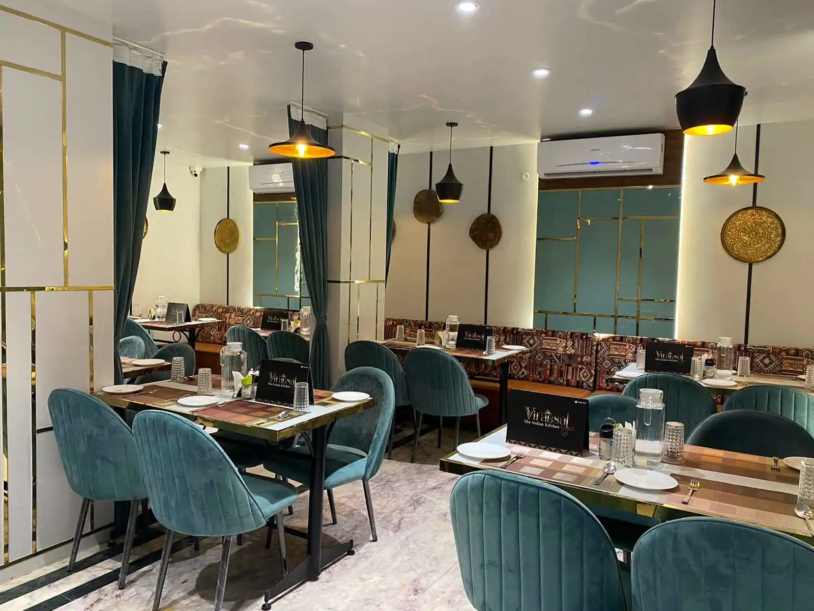 Viraasat restaurant dining hall — warm gold and green interior, Vepery Chennai